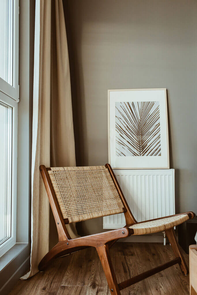 Inviting and calm counseling office space with a modern chair, suggesting a supportive environment for women's therapy.